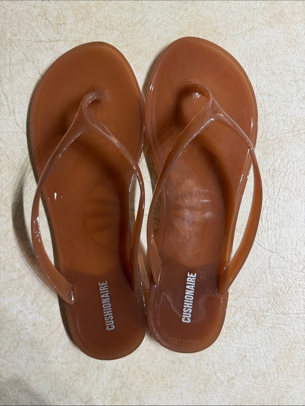 CUSHIONAIRE Women's Tan Jelly Flip Flops - Glossy Casual Sandals